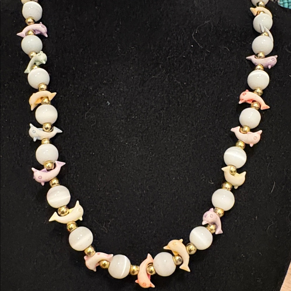 Vintage cats eye with carved dolphins necklace